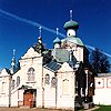 Tikhvinsky district. Tikhvin. Assumption Monastery. Vorotnaya (Gate) Tower and Church Krylechko. XVII-XIX N.L.Benua